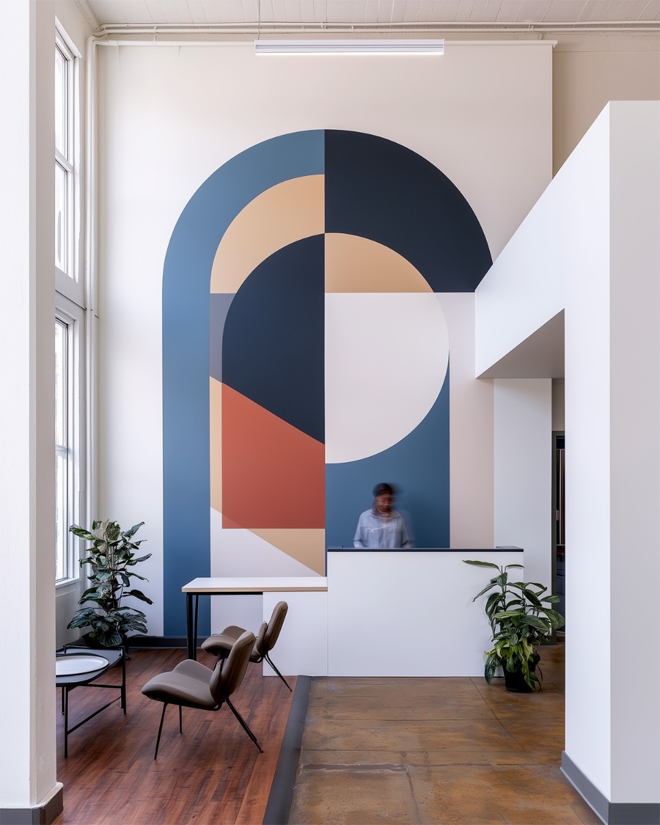 Hand-painted geometric mural commissioned for a corporate office
